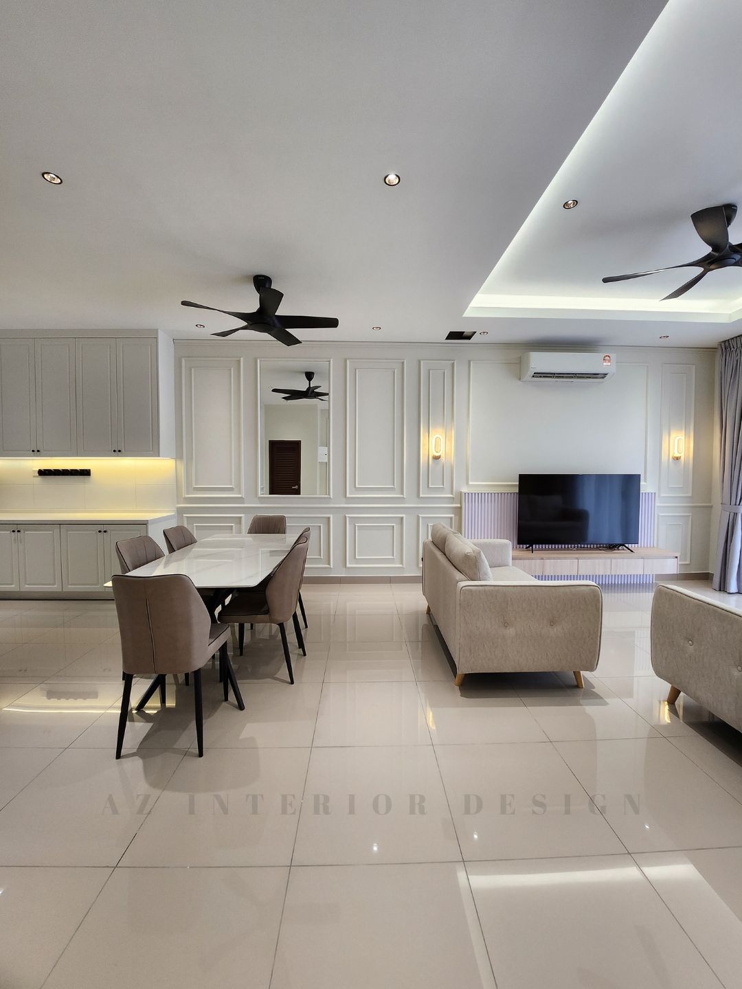 Spacious European-style living and dining area featuring cream panel wall molding, coffered ceiling, black ceiling fan, floating TV console, and dining set in neutral tones