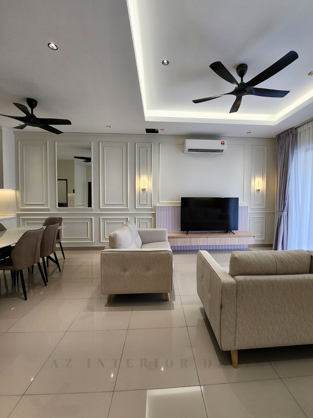 Classic European living room with intricate wall moldings, luxurious fabrics, and refined detailing by AZ Interior Design.